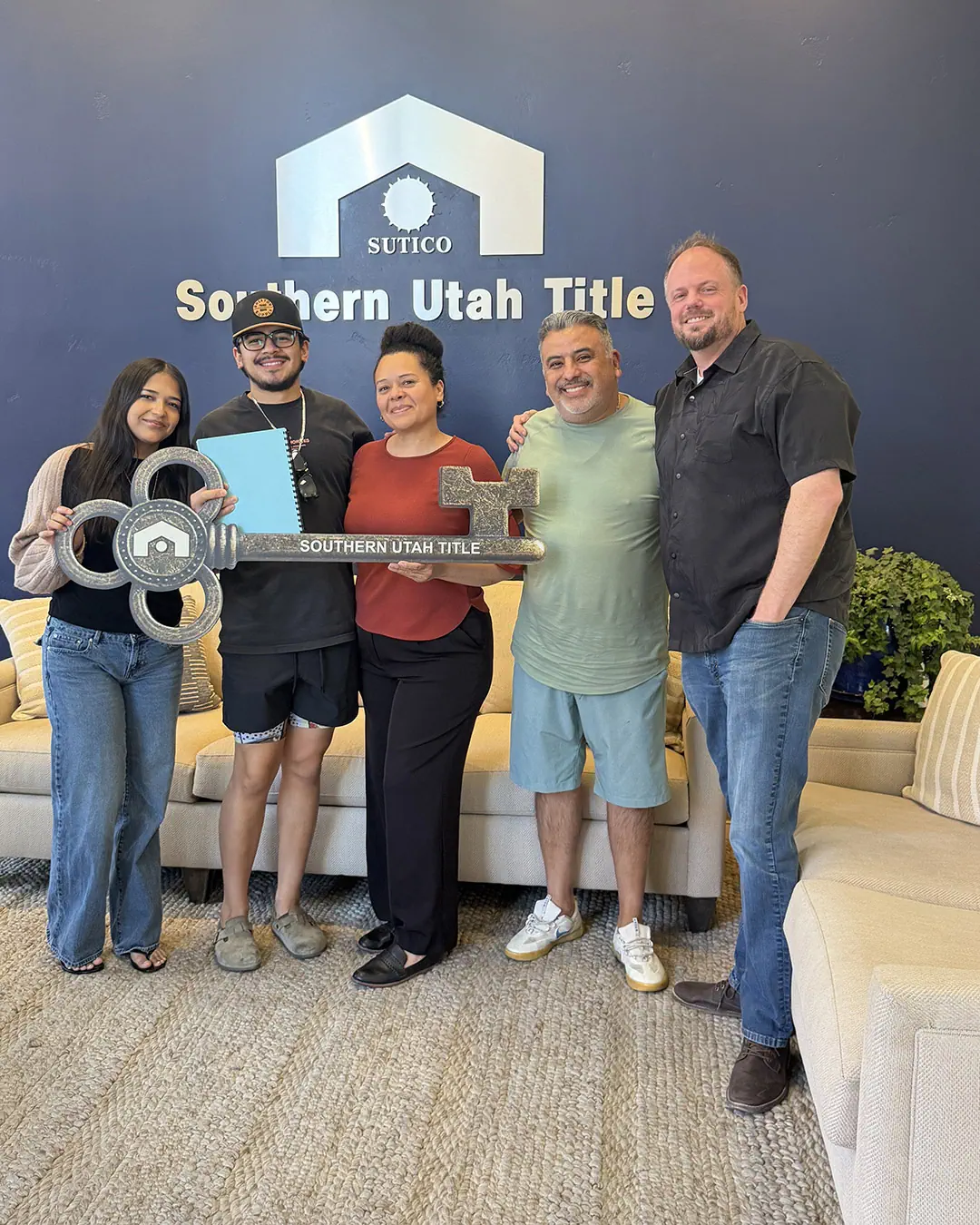 Scott Buehler with Erick and Carmen celebrating their new construction home