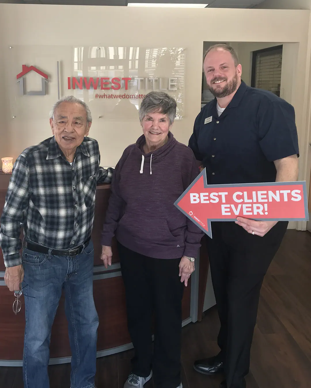 Scott Buehler with Katherine and Pete after closing on their refinance